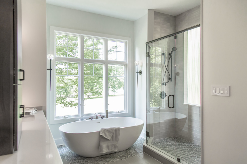 Example of a mid-sized cottage master gray tile and glass tile porcelain tile and gray floor bathroom design in DC Metro with flat-panel cabinets, dark wood cabinets, a two-piece toilet, white walls, an undermount sink, quartz countertops, a hinged shower door and white countertops
