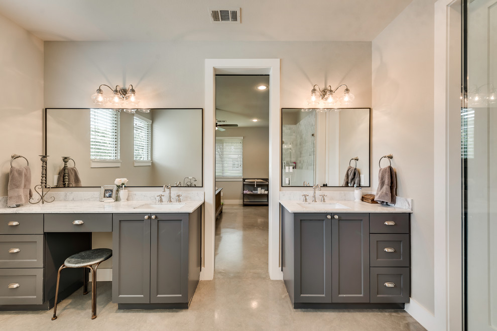 Bathroom - country master beige tile and subway tile concrete floor and beige floor bathroom idea in Dallas with shaker cabinets, gray cabinets, a one-piece toilet, beige walls, an undermount sink, quartzite countertops and a hinged shower door