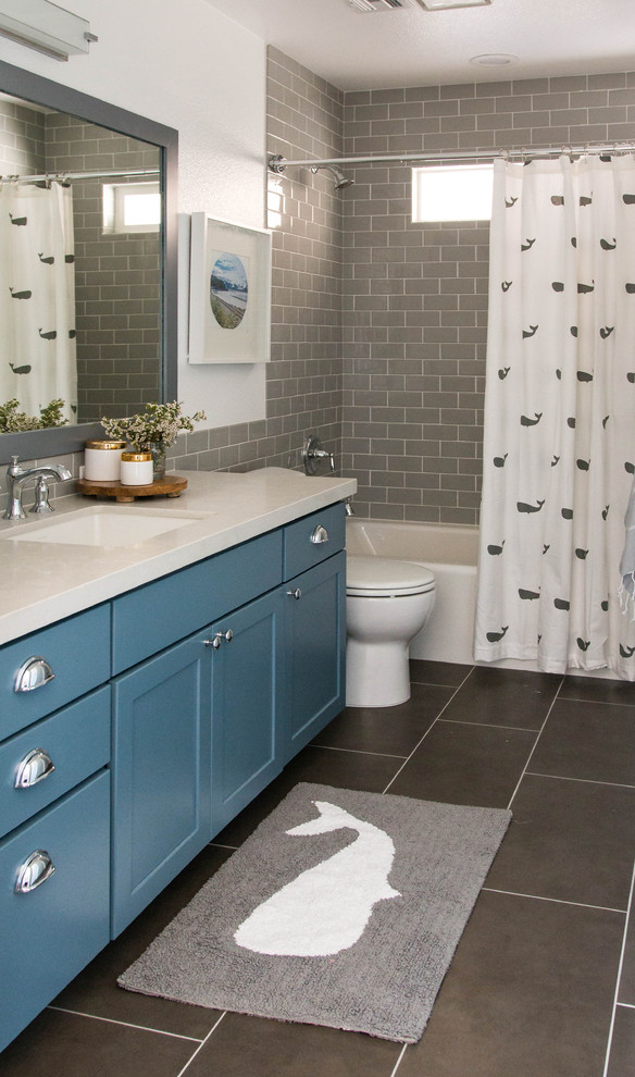 Inspiration for a country ensuite bathroom in Las Vegas with shaker cabinets, blue cabinets, a freestanding bath, a corner shower, white tiles, metro tiles, beige walls, ceramic flooring, quartz worktops, white floors, a hinged door and beige worktops.