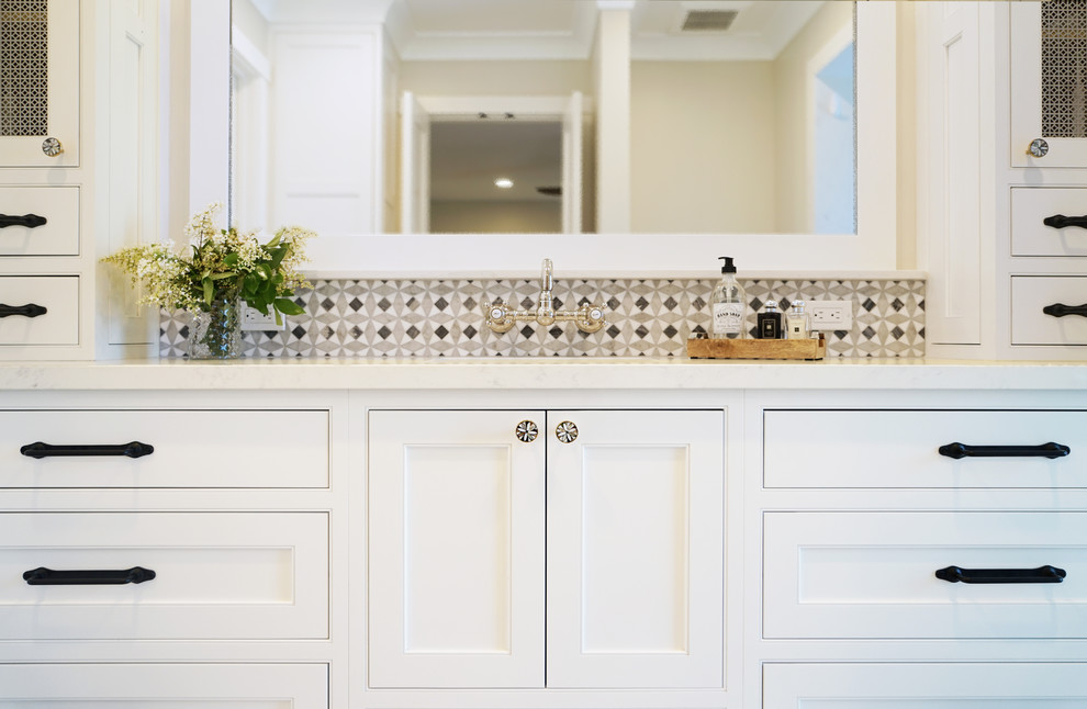 Inspiration for a medium sized farmhouse ensuite bathroom in San Francisco with beaded cabinets, white cabinets, white tiles, mosaic tiles, ceramic flooring, engineered stone worktops, black floors and white worktops.