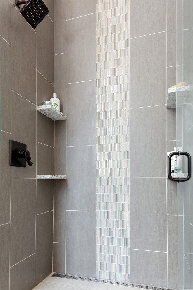Inspiration for a mid-sized transitional 3/4 subway tile and gray tile alcove shower remodel in Seattle with shaker cabinets, white cabinets, a two-piece toilet, gray walls, an undermount sink, quartzite countertops and a hinged shower door