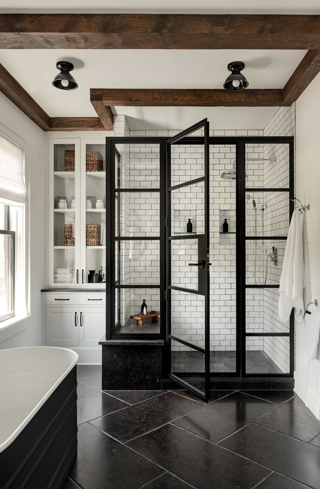 Example of a large cottage master white tile and subway tile slate floor and black floor bathroom design in New York with white walls and a hinged shower door