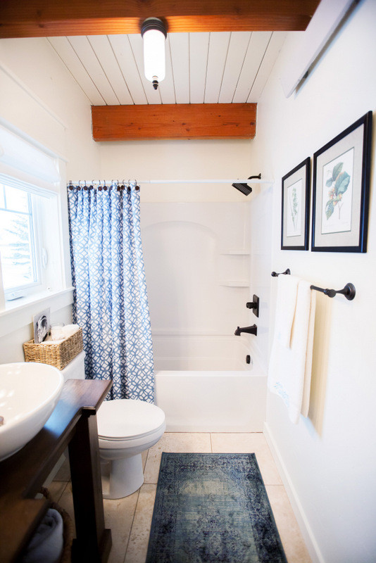 Bathroom - mid-sized cottage 3/4 mosaic tile floor bathroom idea in Other with flat-panel cabinets, a one-piece toilet, white walls, a vessel sink and wood countertops
