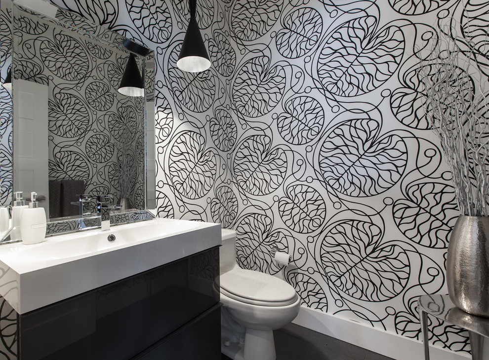 Inspiration for a contemporary bathroom remodel in Other with an integrated sink, a one-piece toilet and multicolored walls