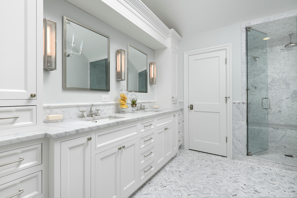 This is an example of a traditional bathroom in Chicago with white tiles, stone tiles and a hinged door.