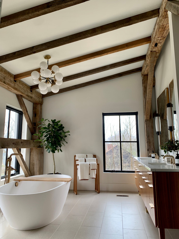 Example of a large minimalist master porcelain tile, white floor, double-sink and exposed beam bathroom design in Cleveland with flat-panel cabinets, medium tone wood cabinets, white walls, an undermount sink, quartzite countertops, a hinged shower door, white countertops and a freestanding vanity