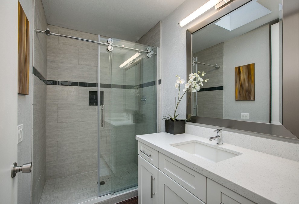 Small classic shower room bathroom in Other with shaker cabinets, white cabinets, an alcove shower, beige tiles, porcelain tiles, a submerged sink, engineered stone worktops, a sliding door, white worktops and grey walls.