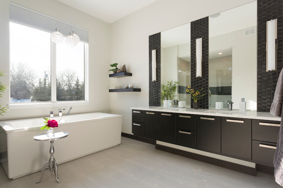 Contemporary ensuite bathroom in Other with flat-panel cabinets, black cabinets, an alcove shower, black tiles, matchstick tiles, beige walls, a submerged sink, grey floors, a hinged door and beige worktops.