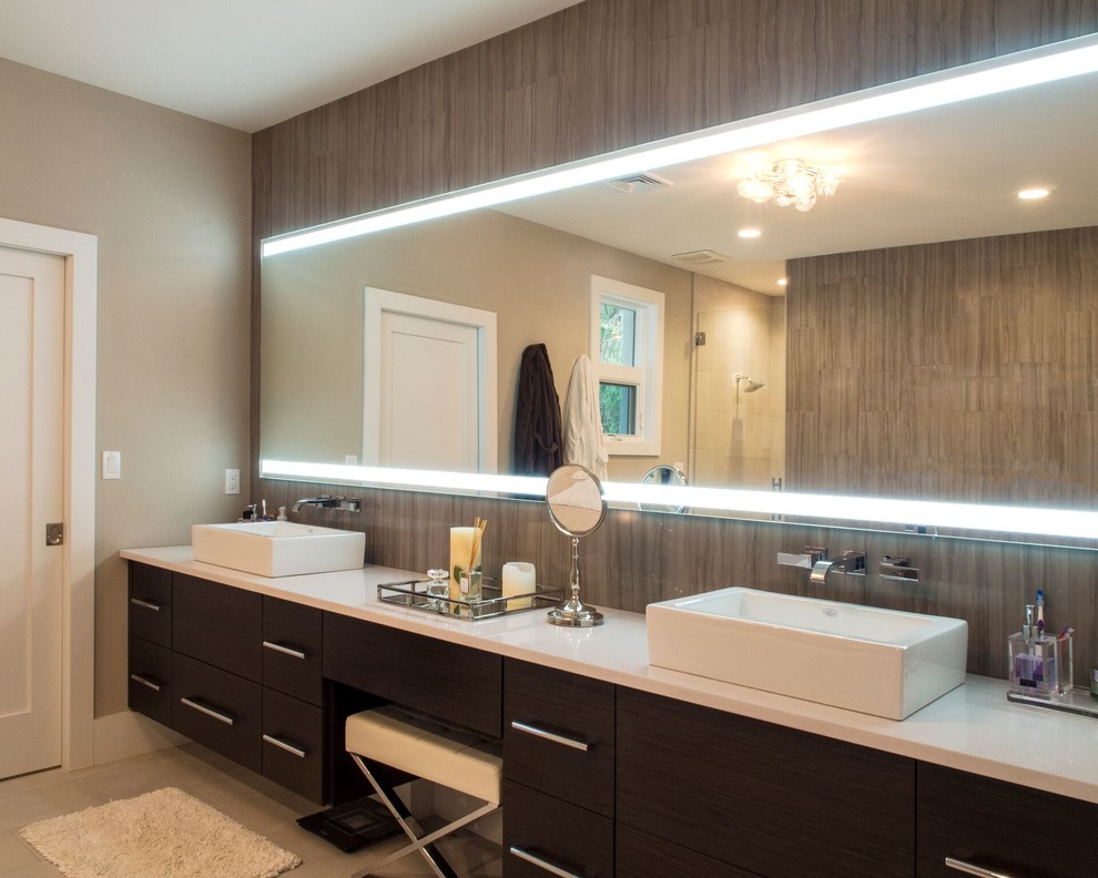 Design ideas for a medium sized contemporary ensuite bathroom in Philadelphia with flat-panel cabinets, brown cabinets, beige tiles, porcelain tiles, beige walls, porcelain flooring, a vessel sink, engineered stone worktops, beige floors and white worktops.