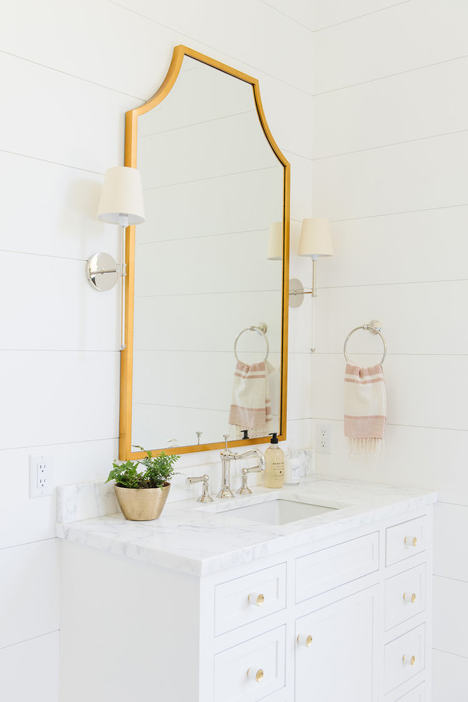 Mid-sized farmhouse bathroom photo in Salt Lake City with white cabinets, marble countertops, a hinged shower door and multicolored countertops