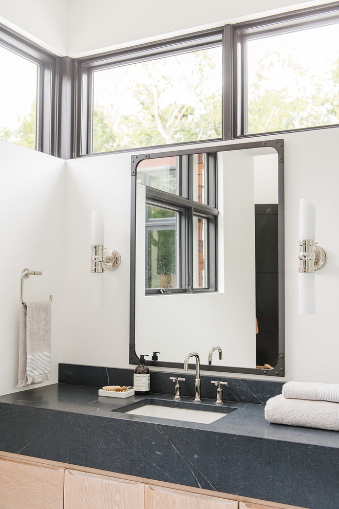 Inspiration for a medium sized rural shower room bathroom in Salt Lake City with flat-panel cabinets, light wood cabinets, a corner shower, white tiles, white walls, an open shower and black worktops.