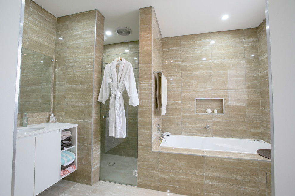 Bathroom - mid-sized contemporary master beige tile and porcelain tile porcelain tile and beige floor bathroom idea in Sydney with a hinged shower door, flat-panel cabinets, white cabinets, a two-piece toilet, beige walls, an undermount sink, quartz countertops and white countertops