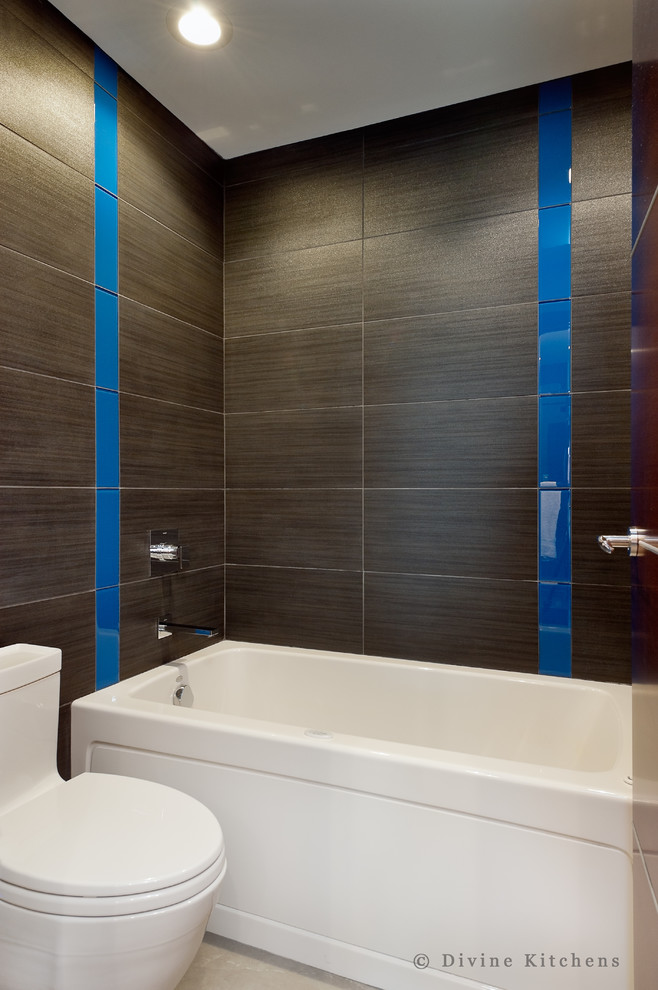 Example of a large minimalist master brown tile and porcelain tile porcelain tile bathroom design in Boston with flat-panel cabinets, dark wood cabinets, quartz countertops, an undermount sink, a two-piece toilet and white walls