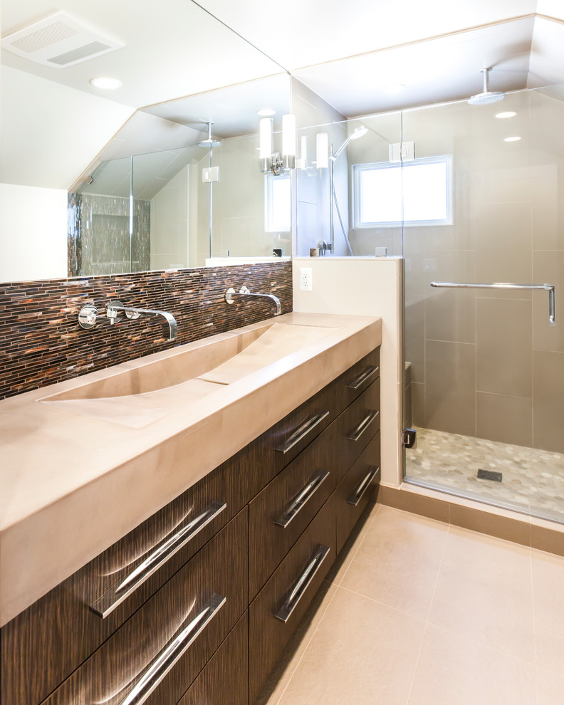 Example of a small minimalist master beige tile and ceramic tile ceramic tile bathroom design in Detroit with a trough sink, flat-panel cabinets, dark wood cabinets, concrete countertops, a wall-mount toilet and beige walls