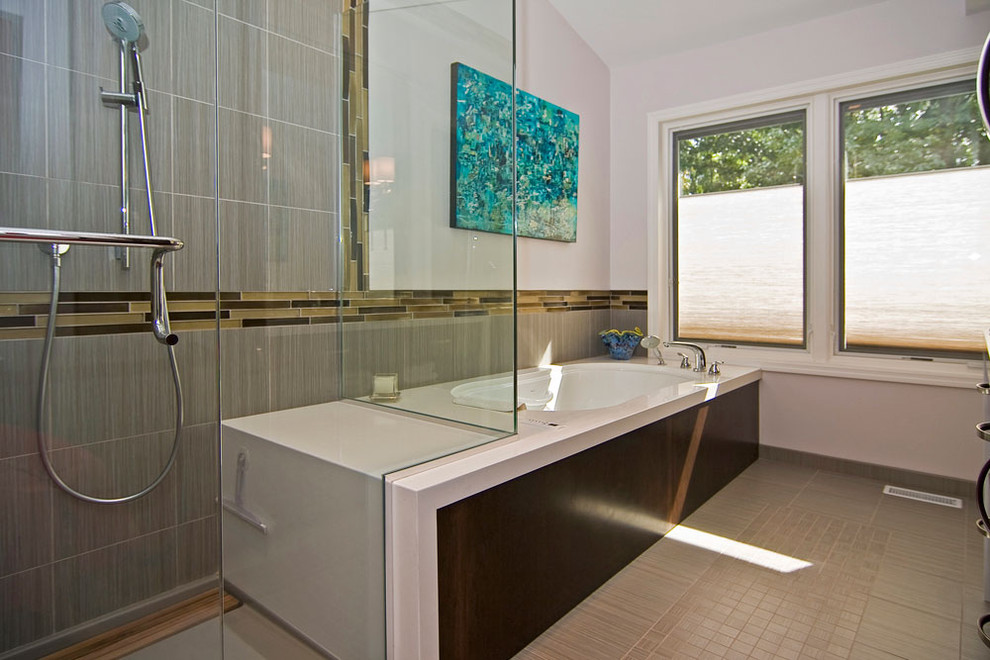 Mid-sized minimalist master gray tile and porcelain tile porcelain tile and beige floor corner shower photo in St Louis with flat-panel cabinets, dark wood cabinets, a two-piece toilet, white walls, an undermount sink, an undermount tub, quartz countertops and a hinged shower door