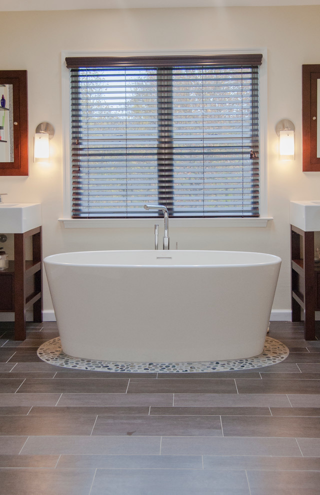 Inspiration for a mid-sized zen master gray tile and pebble tile porcelain tile freestanding bathtub remodel in Philadelphia with a vessel sink, open cabinets and dark wood cabinets