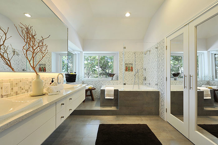 Inspiration for a mid-sized modern master gray tile and porcelain tile porcelain tile bathroom remodel in Dallas with flat-panel cabinets, a drop-in sink, white cabinets, granite countertops, a two-piece toilet and white walls