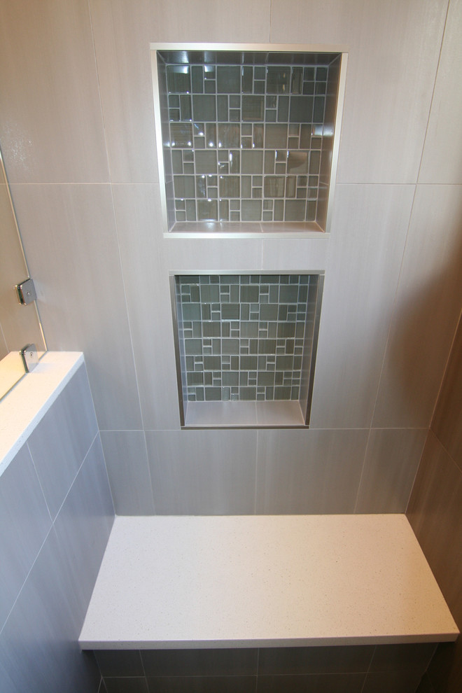 Example of a mid-sized trendy master gray tile and ceramic tile ceramic tile alcove shower design in San Francisco with quartz countertops, an undermount sink, flat-panel cabinets, dark wood cabinets, a two-piece toilet and gray walls