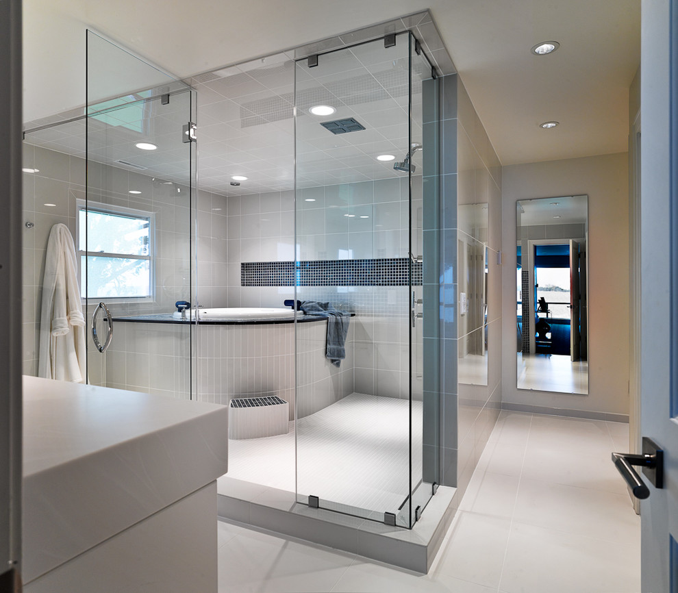 Example of a large minimalist master gray tile and ceramic tile white floor bathroom design in Other with flat-panel cabinets, white cabinets, gray walls, a trough sink, quartz countertops, a hinged shower door and white countertops