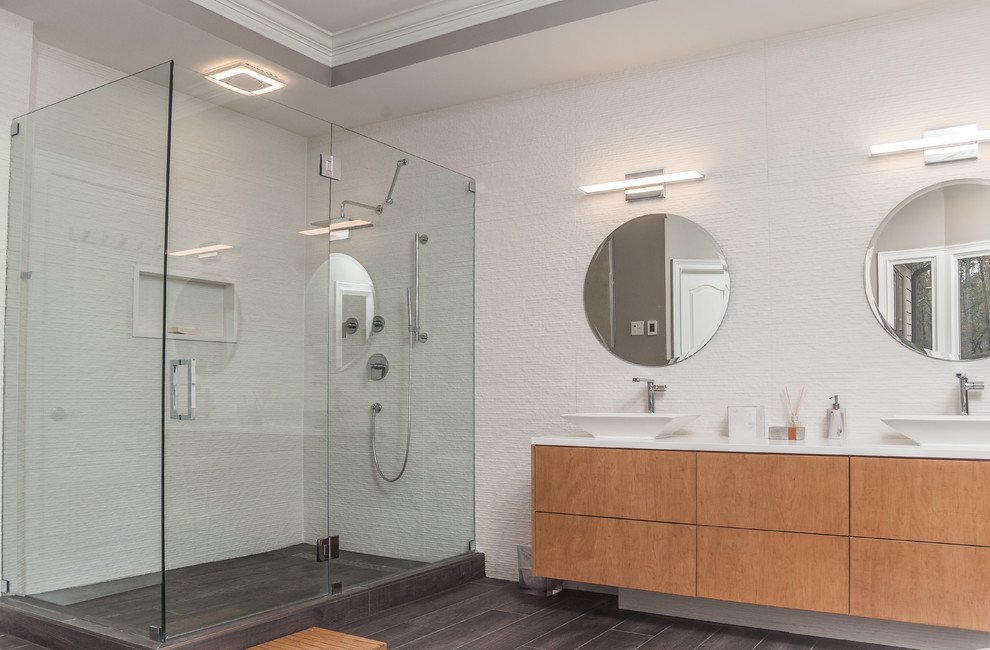 Large minimalist master white tile and porcelain tile porcelain tile and gray floor freestanding bathtub photo in Atlanta with flat-panel cabinets, light wood cabinets, a one-piece toilet, gray walls, a vessel sink, quartzite countertops, a hinged shower door and white countertops