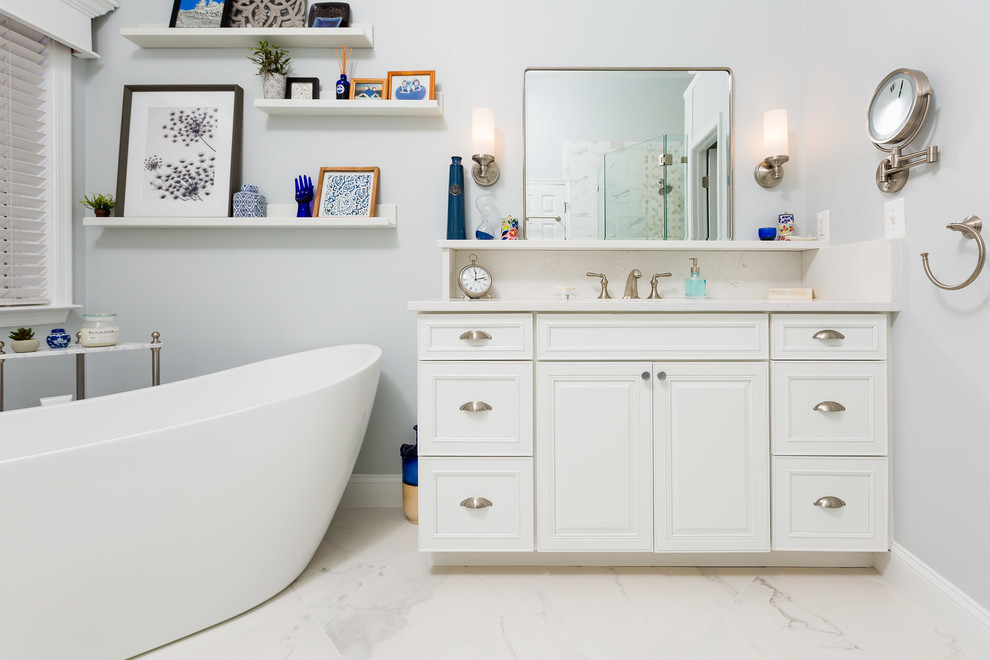 Freestanding bathtub - modern freestanding bathtub idea in DC Metro with raised-panel cabinets, white cabinets, gray walls, an undermount sink, a hinged shower door and white countertops