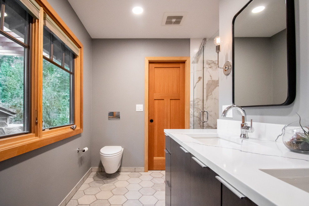 Mid-sized minimalist master white tile and porcelain tile porcelain tile, gray floor and double-sink alcove shower photo in Portland with flat-panel cabinets, black cabinets, a wall-mount toilet, gray walls, an undermount sink, quartz countertops, a hinged shower door, white countertops, a niche and a built-in vanity