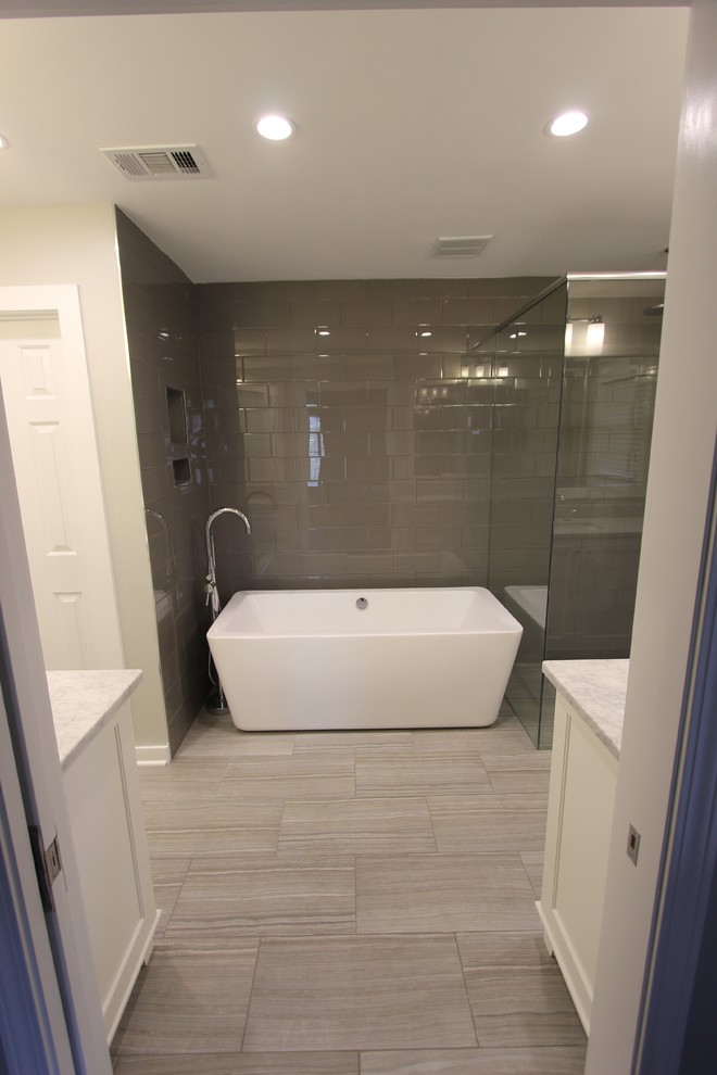 Example of a mid-sized minimalist master glass tile and gray tile porcelain tile bathroom design in Atlanta with an undermount sink, shaker cabinets, white cabinets, marble countertops, a one-piece toilet and gray walls