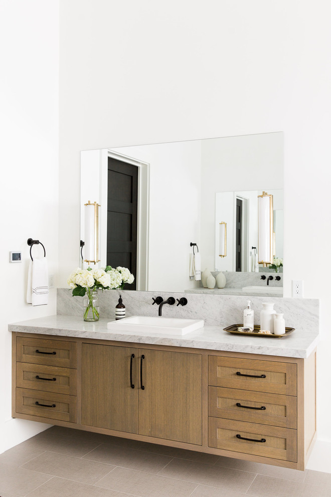 Inspiration for a classic bathroom in Salt Lake City with light wood cabinets, a walk-in shower, a one-piece toilet, white walls, marble worktops, shaker cabinets and a built-in sink.