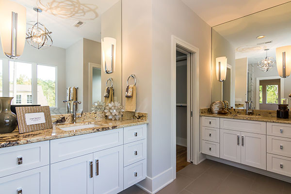 Inspiration for a modern bathroom remodel in Raleigh with white cabinets, a one-piece toilet and white walls