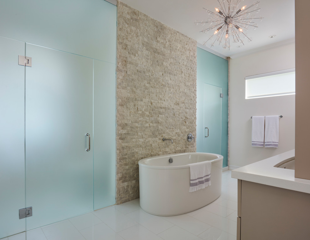 Inspiration for a large modern master beige tile and stone tile white floor bathroom remodel in Miami with beaded inset cabinets, beige cabinets, a one-piece toilet, beige walls, an undermount sink, quartz countertops and a hinged shower door