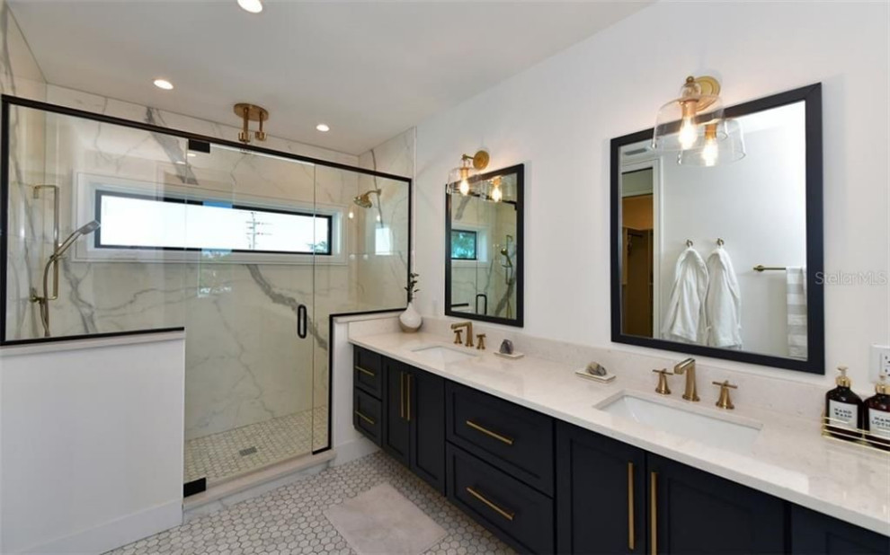 Photo of a large modern ensuite bathroom in Tampa with freestanding cabinets, white walls, marble worktops, a hinged door, white worktops, double sinks and a built in vanity unit.