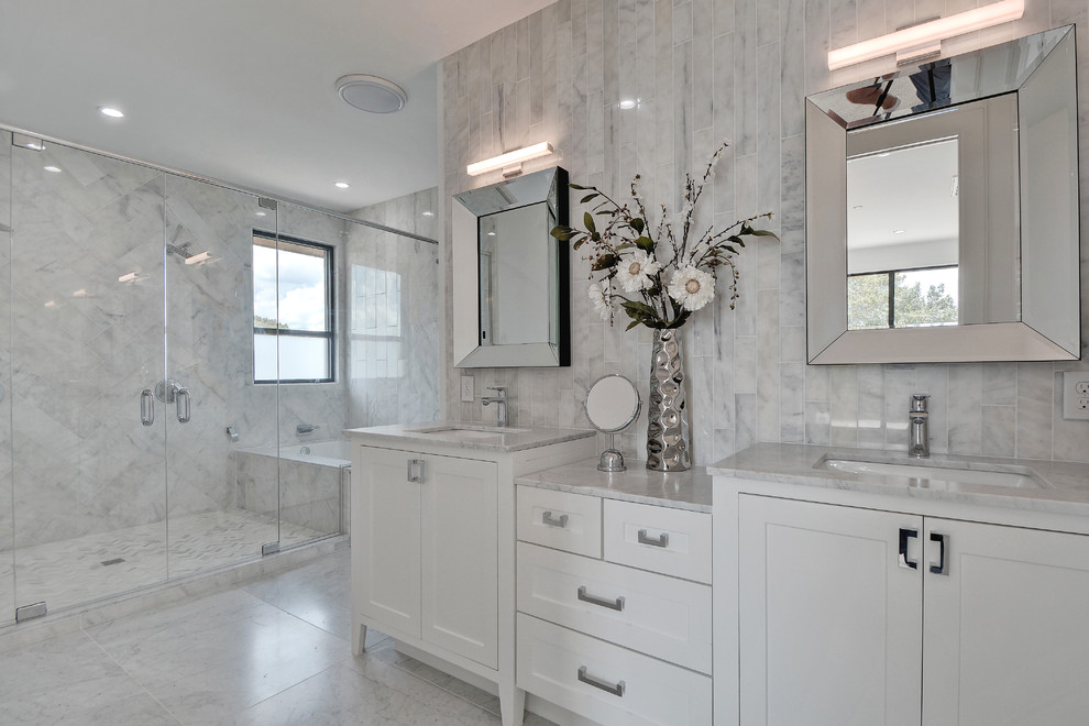 Large transitional master gray tile and marble tile marble floor and white floor alcove shower photo in Nashville with shaker cabinets, white cabinets, an undermount sink, an undermount tub, a one-piece toilet, marble countertops, gray walls, a hinged shower door and white countertops