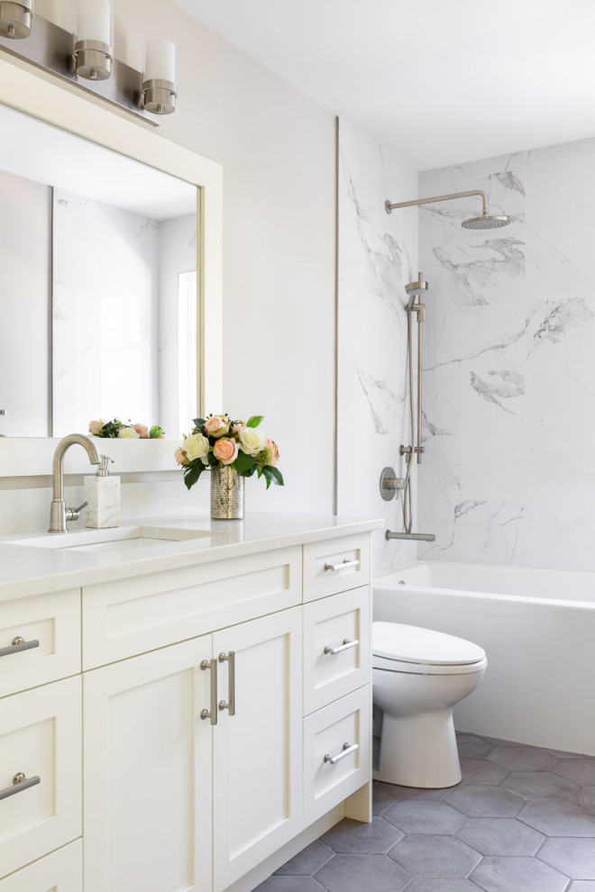 Traditional bathroom in Calgary with shaker cabinets, white cabinets, an alcove bath, a shower/bath combination, white tiles, grey walls, a submerged sink, grey floors, white worktops, a single sink and a built in vanity unit.