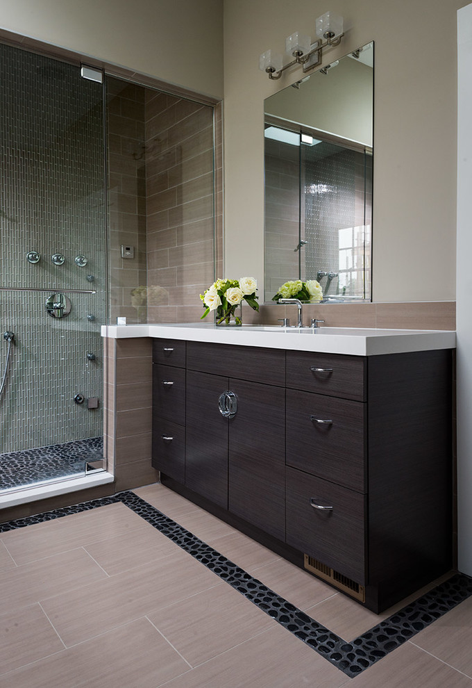 Example of a mid-sized mountain style master beige tile and porcelain tile porcelain tile double shower design in Chicago with flat-panel cabinets, dark wood cabinets, solid surface countertops and beige walls