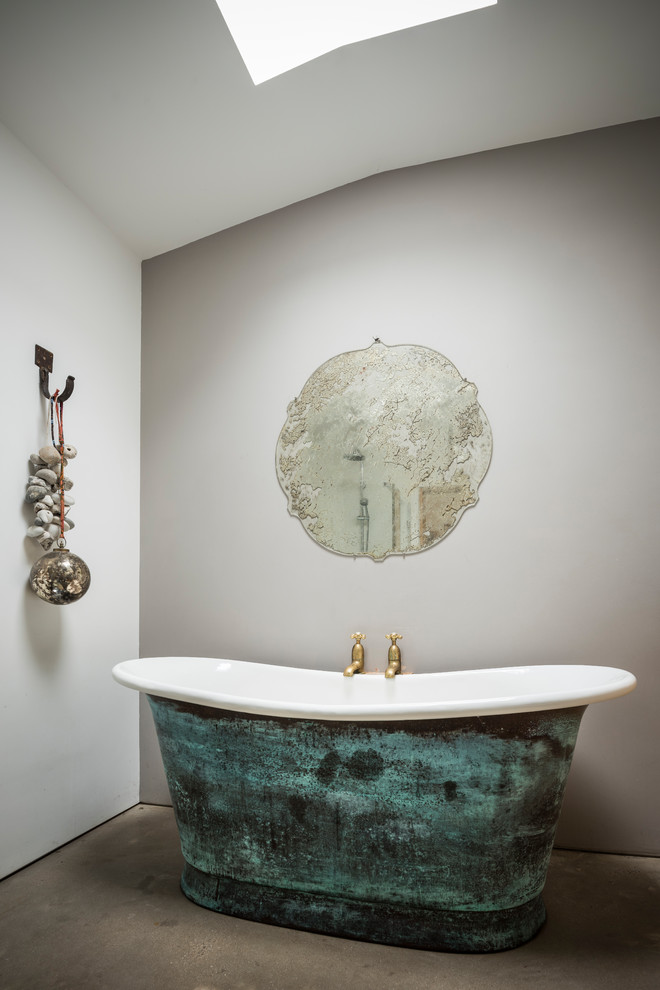 Inspiration for a rustic bathroom in Dorset with a freestanding bath.