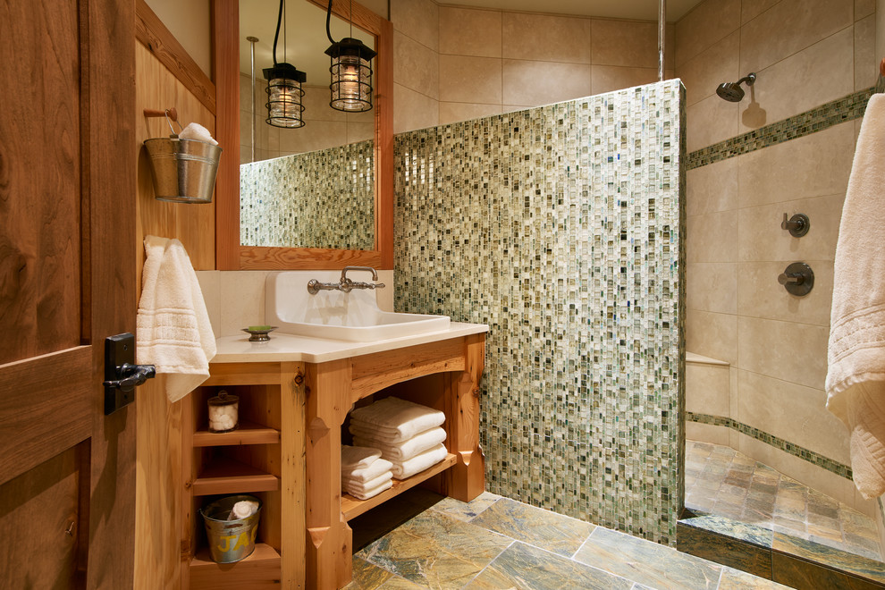 Example of a mountain style kids' green tile and glass tile doorless shower design in Denver with a drop-in sink, furniture-like cabinets, light wood cabinets, quartz countertops and beige walls