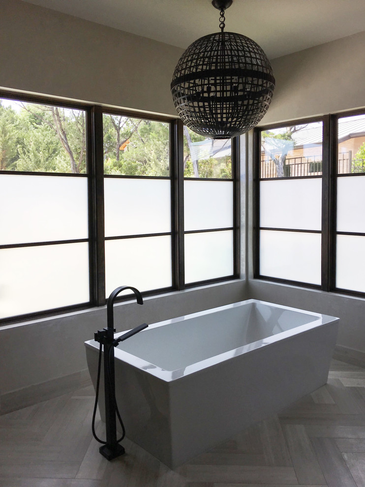 Example of a transitional master bathroom design in Austin