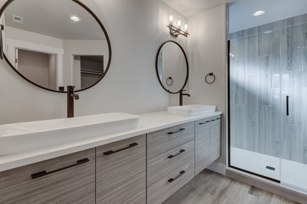 Mid-sized trendy master vinyl floor doorless shower photo in Other with flat-panel cabinets, light wood cabinets, beige walls, a vessel sink, quartz countertops, a hinged shower door and white countertops