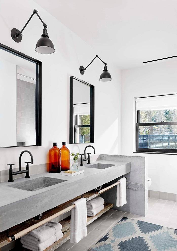 Urban master bathroom photo in Austin with an integrated sink and concrete countertops