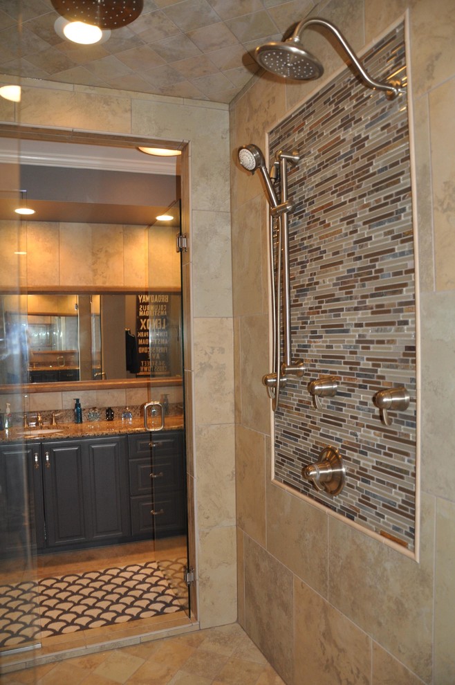 This is an example of a medium sized traditional ensuite bathroom in Other with raised-panel cabinets, black cabinets, an alcove shower, beige tiles, ceramic tiles, beige walls, ceramic flooring, a submerged sink, granite worktops and beige floors.