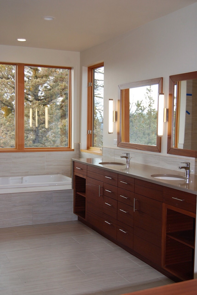 На фото: ванная комната в современном стиле с металлической плиткой, врезной раковиной, столешницей из искусственного кварца, серой столешницей, тумбой под две раковины и подвесной тумбой