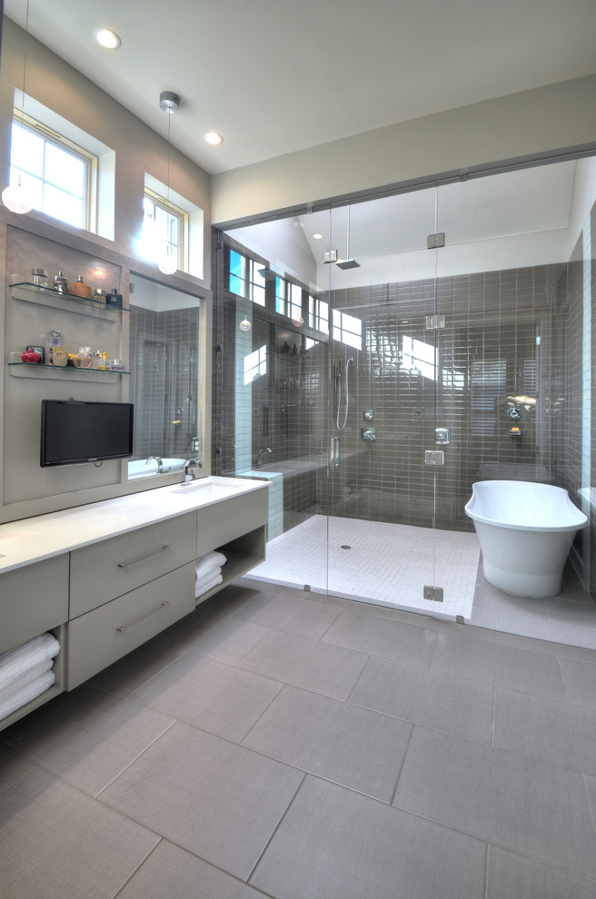 This is an example of a contemporary bathroom in Dallas with a freestanding bath and a shower bench.