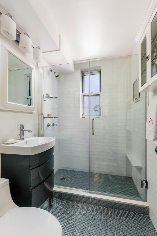 Inspiration for a small modern shower room bathroom in New York with freestanding cabinets, black cabinets, an alcove shower, a one-piece toilet, white tiles, ceramic tiles, white walls, mosaic tile flooring, an integrated sink, solid surface worktops, grey floors and a hinged door.