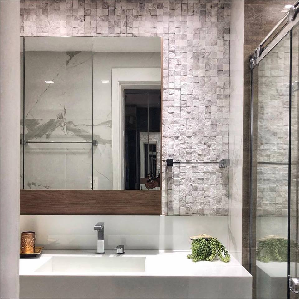 Mid-sized minimalist white tile and marble tile bathroom photo in Miami with white cabinets, white walls, an integrated sink and white countertops