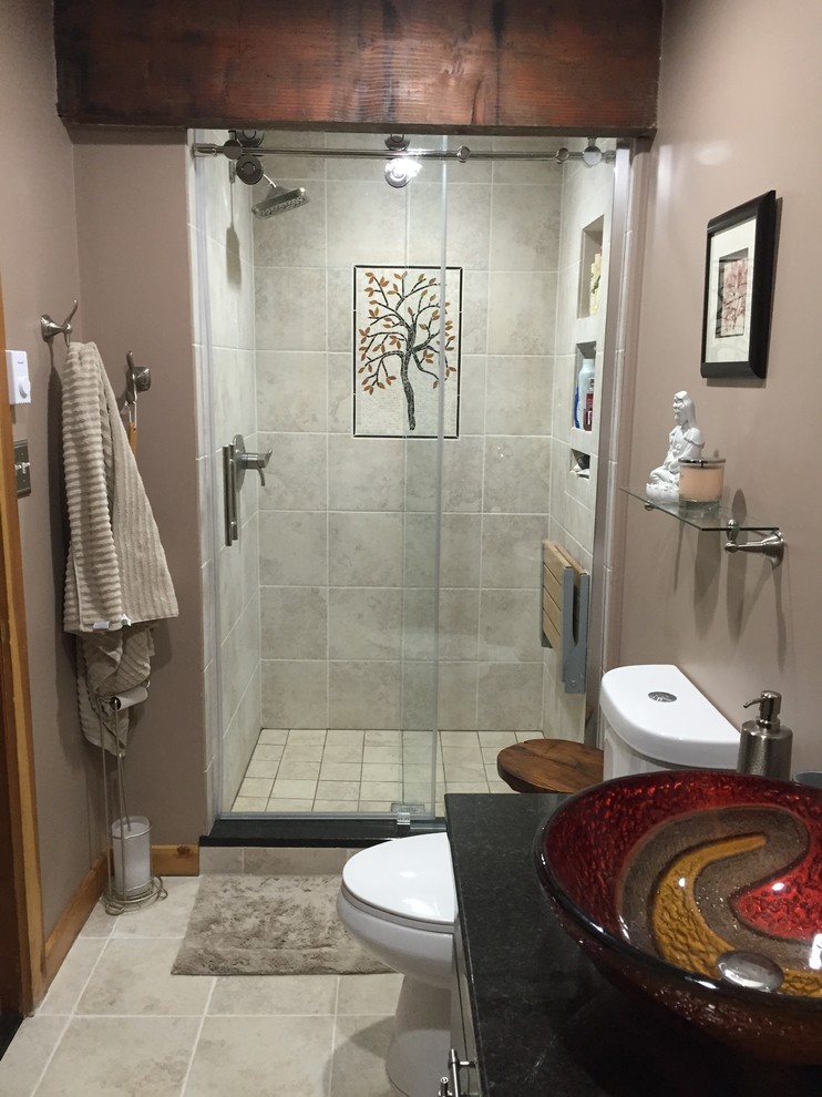 Example of a minimalist multicolored tile and porcelain tile porcelain tile alcove shower design in Philadelphia with flat-panel cabinets, dark wood cabinets, a two-piece toilet, beige walls, a vessel sink and granite countertops