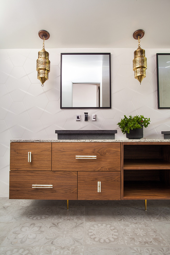 Bathroom - mid-sized mid-century modern 3/4 mosaic tile floor bathroom idea in Los Angeles with flat-panel cabinets, medium tone wood cabinets, white walls, a vessel sink and granite countertops