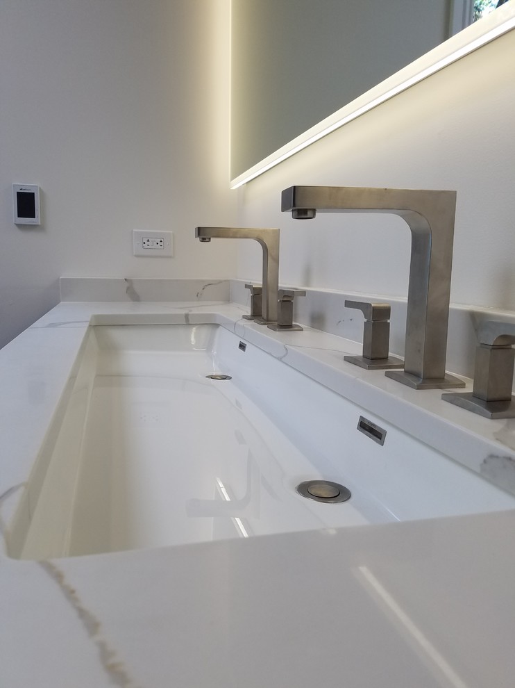 Inspiration for a large modern ensuite bathroom in Chicago with grey cabinets, a freestanding bath, an alcove shower, white tiles, grey walls, porcelain flooring, a submerged sink, engineered stone worktops, multi-coloured floors and a hinged door.