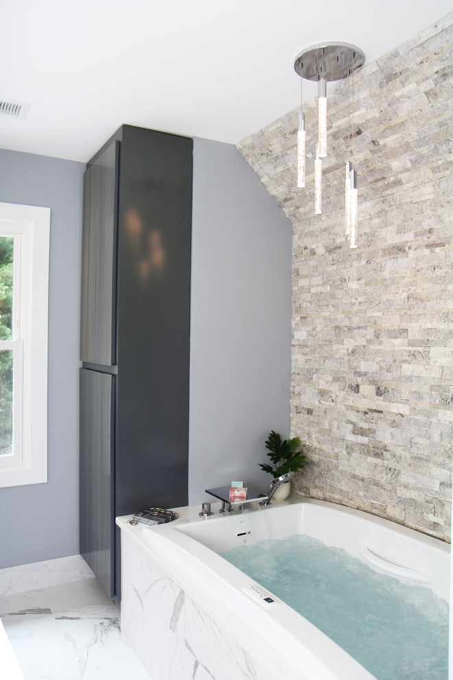 Photo of a medium sized modern ensuite bathroom in Atlanta with flat-panel cabinets, medium wood cabinets, a built-in bath, a built-in shower, a bidet, black and white tiles, porcelain tiles, grey walls, porcelain flooring, a submerged sink, engineered stone worktops, white floors, a hinged door and white worktops.