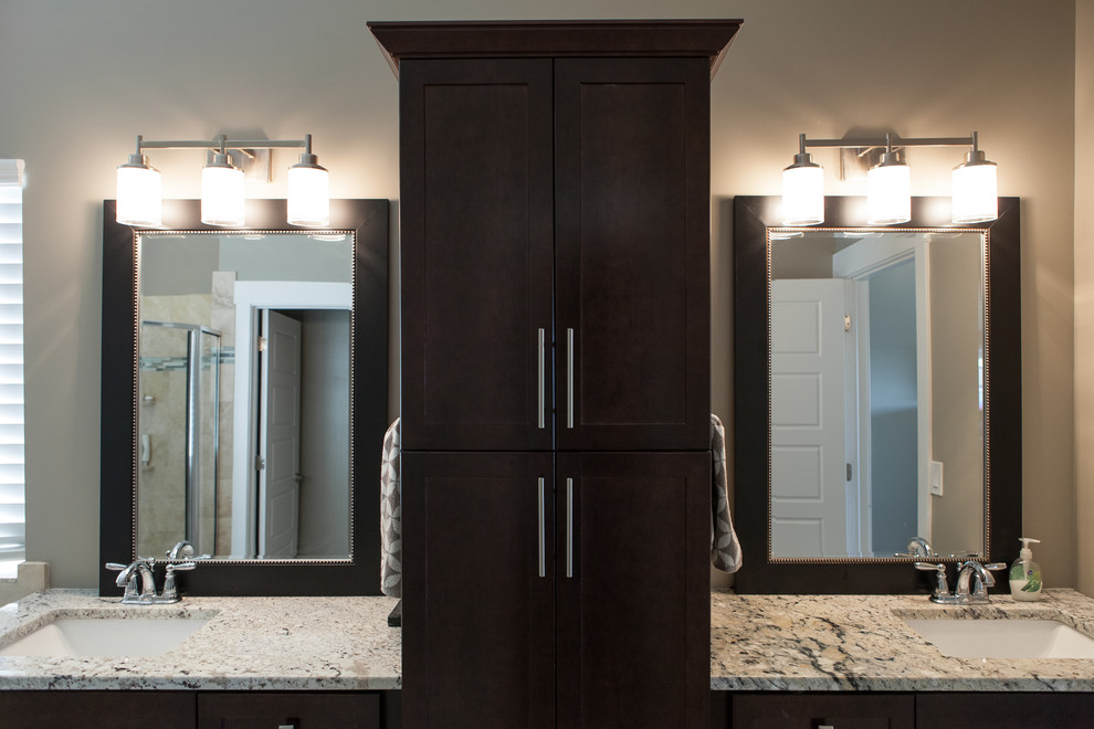 Example of a large transitional master gray tile light wood floor bathroom design in Salt Lake City with an undermount sink, shaker cabinets, dark wood cabinets, granite countertops, a one-piece toilet and beige walls