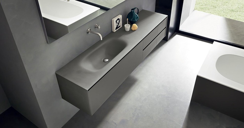 Exempel på ett modernt badrum, med ett integrerad handfat
